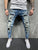 European and American high-quality ripped beggar pad fabric stretch fashion slim denim men's pants