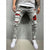 European and American high-quality ripped beggar pad fabric stretch fashion slim denim men's pants