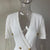 HarleyFashion New Unique Designer European Celebrity Sexy V-neck Short Sleeve Double Breasted Buttons White Straight Knit Dress