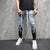 Men Ripped Jeans Slim Fit Trousers Fashion Flame Print Distressed Fringe Pencil Jeans Homme Casual Drawstring Skinny Denim Pants